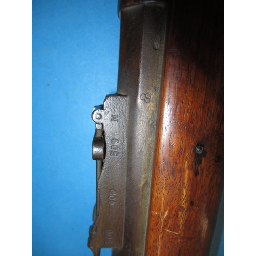 258 - An antique hammer rifle with trap door breech, approx. length 135cm pre-owned with use-related marks