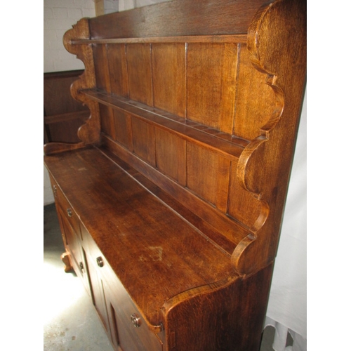 327 - A vintage oak dresser with top rack, in good useable pre-owned condition, approx. dimensions H 154cm... 