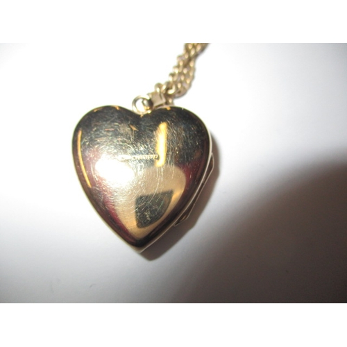 73 - A 9ct yellow gold necklace with heart shape locket pendant, approx. linear length of chain 50cm, app... 