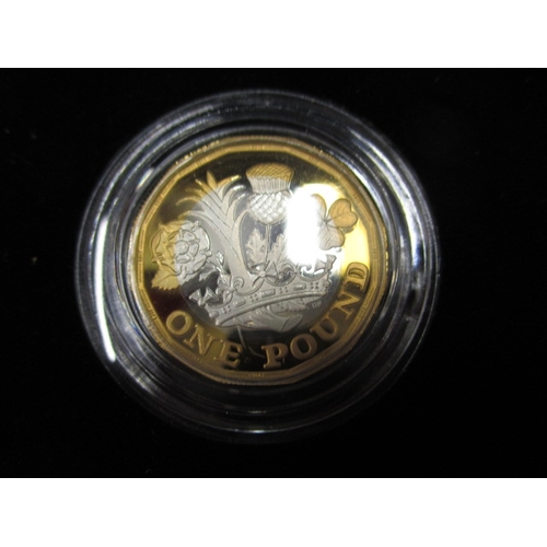 163 - A 1g fine gold bullion bar and a silver proof £1 coin and  one other collectors coin, all in good pr... 