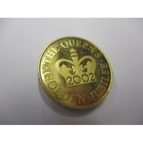 138 - A 2002 gold jubilee collectors coin, in uncirculated condition, approx. weight 7g