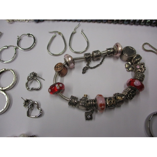 220 - A parcel of costume jewellery to include some gold and silver items and a Pandora charm bracelet, al... 