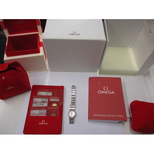 100 - A ladies Omega 1456 wrist watch, having diamond set bezel, in working order with box and all paperwo... 