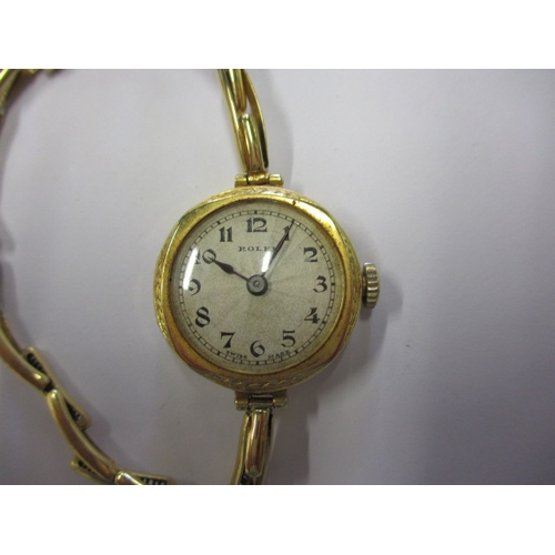 101 - A vintage 18ct gold ladies Rolex wrist watch, with expandable strap, approx. dial diameter 21mm, in ... 