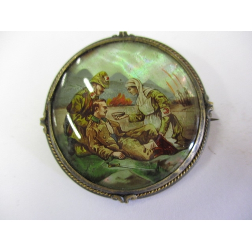 229 - A 19th century hand-painted on mother of pearl brooch depicting a Crimea war scene, in good used con... 