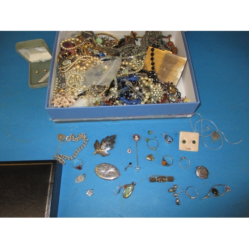 221 - A large quantity of vintage costume jewellery, to include some silver items and a gold pendant and a... 