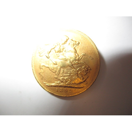 141 - A Victorian gold sovereign dated 1892, a well worn BV grade coin