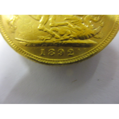 141 - A Victorian gold sovereign dated 1892, a well worn BV grade coin