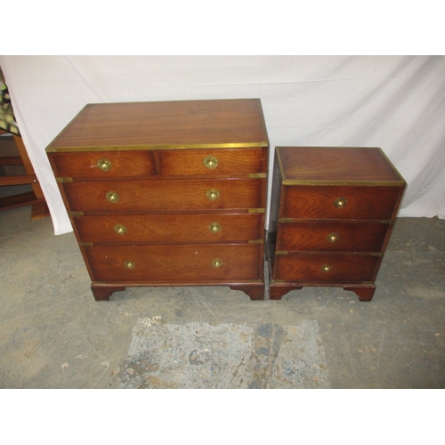 324 - A contemporary campaign style mahogany and brass chest of drawers and bedside cabinet. Approximate d... 