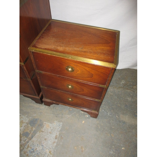 324 - A contemporary campaign style mahogany and brass chest of drawers and bedside cabinet. Approximate d... 