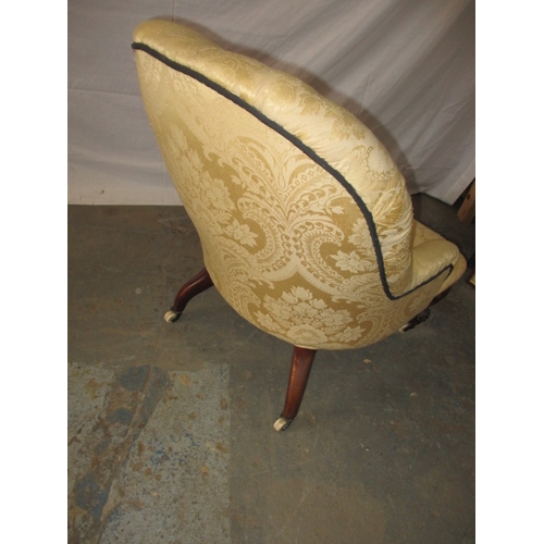 321 - A Victorian upholstered parlour low comfort chair, with original brass and ceramic casters. General ... 