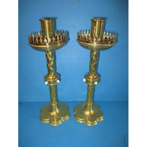 235 - A stunning pair of Victorian Gothic Revival brass altar candlesticks, probably to a design by A.W.N.... 