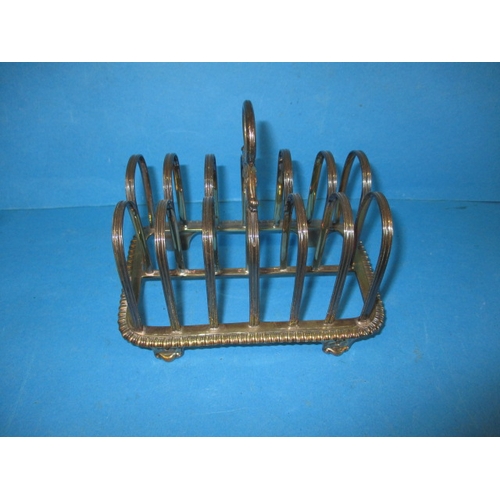 192 - A George III sterling silver toast rack date marked 1819/20, approx. weight 395g makers mark WE, in ... 