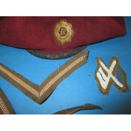 247 - A 1945 dated British Airborne RASC maroon Kangol beret with cap badge, medals and photo, all in used... 