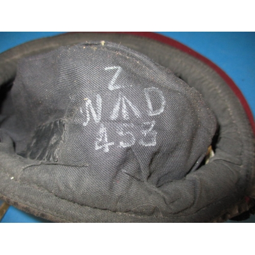 247 - A 1945 dated British Airborne RASC maroon Kangol beret with cap badge, medals and photo, all in used... 