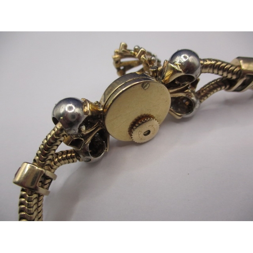 102 - A 9ct gold Jaeger LeCoultre bracelet watch  with diamonds and gem stones to strap, in working order.... 