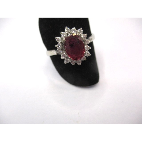 29 - A white gold diamond and ruby dress ring, approx. ring size ‘V’, approx. weight 3.8g in useable pre-... 