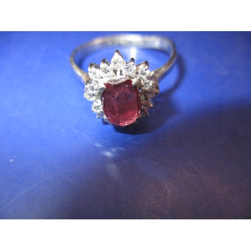 29 - A white gold diamond and ruby dress ring, approx. ring size ‘V’, approx. weight 3.8g in useable pre-... 