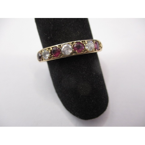 34 - A 9ct yellow gold diamond and ruby half eternity ring, approx. ring size ‘O’, approx. weight 2.3g in... 