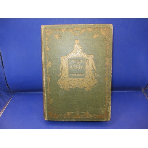 237 - Peter and Wendy hardback first edition by J M Barrie, dated 1911, in used condition with bumping to ... 