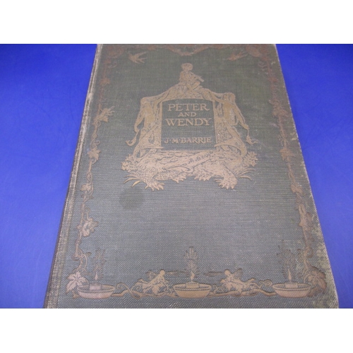 237 - Peter and Wendy hardback first edition by J M Barrie, dated 1911, in used condition with bumping to ... 