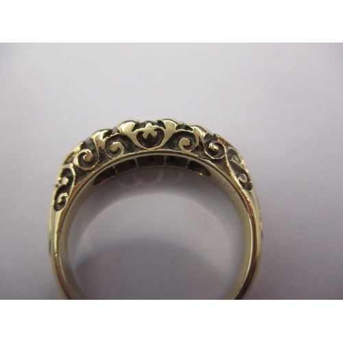 12 - An antique 15ct yellow gold and diamond ring, having 5 graduated old cut diamonds, approx. ring size... 