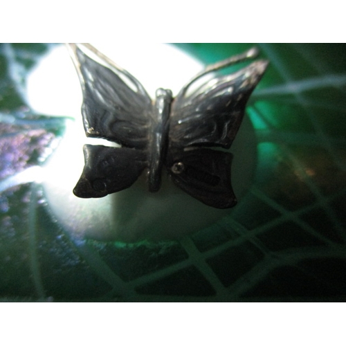 276 - A vintage John Ditchfield waterlily glass paperweight with silver butterfly, approx. diameter 12.5cm... 