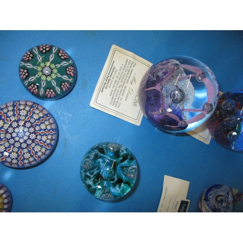 278 - A quantity of collectable Scottish glass paperweight, to include examples by Caithness, Selkirk and ... 