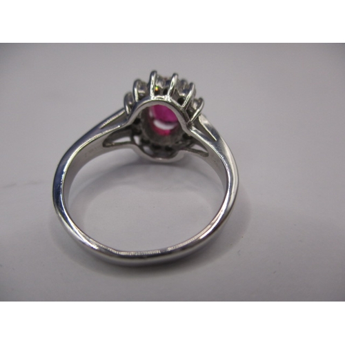 40 - A 14k white gold diamond and ruby ring, approx. ring size ‘J+’, approx. size of ruby 8x6mm, approx. ... 