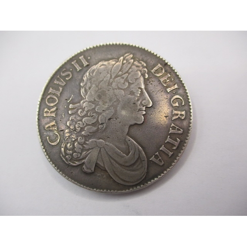 166 - A Charles II Silver crown dated 1676, a circulated coin with very fine definition of features