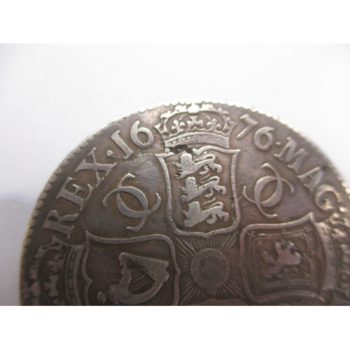 166 - A Charles II Silver crown dated 1676, a circulated coin with very fine definition of features