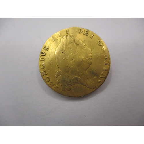 148 - A George III gold half spade guinea dated 1794, a circulated coin with reasonable definition of feat... 