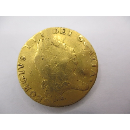 148 - A George III gold half spade guinea dated 1794, a circulated coin with reasonable definition of feat... 