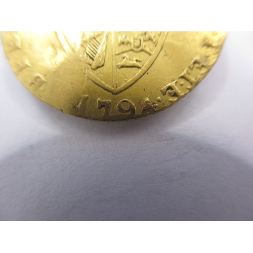 148 - A George III gold half spade guinea dated 1794, a circulated coin with reasonable definition of feat... 