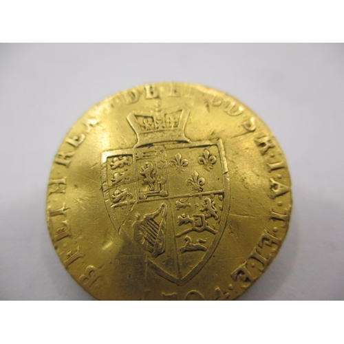 148 - A George III gold half spade guinea dated 1794, a circulated coin with reasonable definition of feat... 