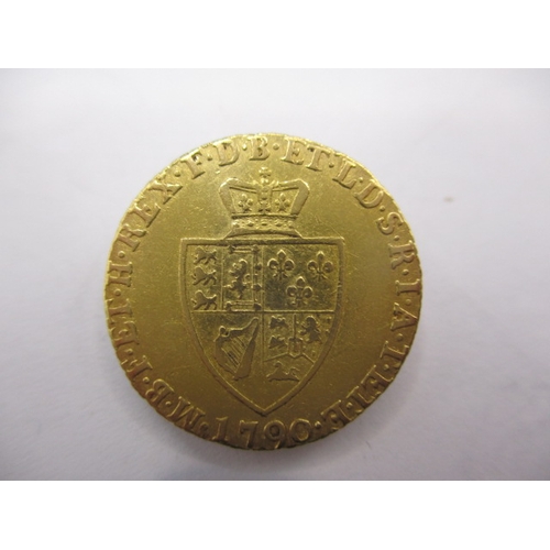 149 - A George III gold half spade guinea dated 1790, a circulated coin with very fine definition of featu... 