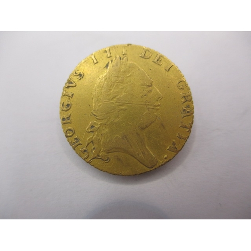 150 - A George III gold half spade guinea dated 1793 a circulated coin with fine definition of features, a... 