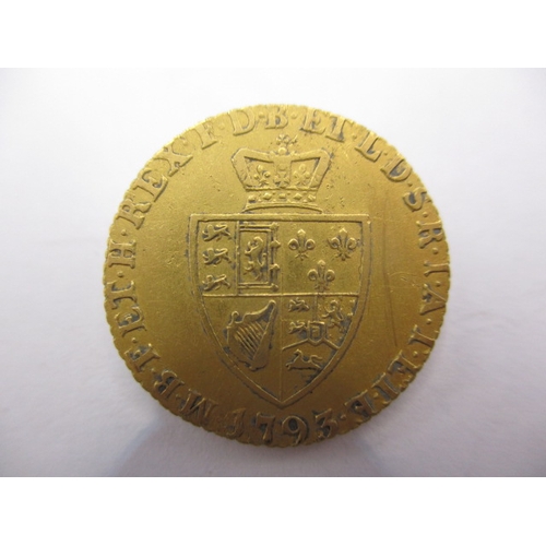 150 - A George III gold half spade guinea dated 1793 a circulated coin with fine definition of features, a... 