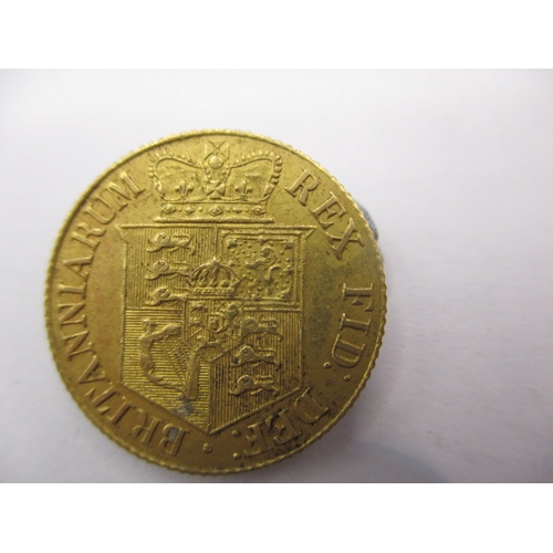 152 - A George III gold half sovereign dated 1818, a circulated coin with very fine definition of features