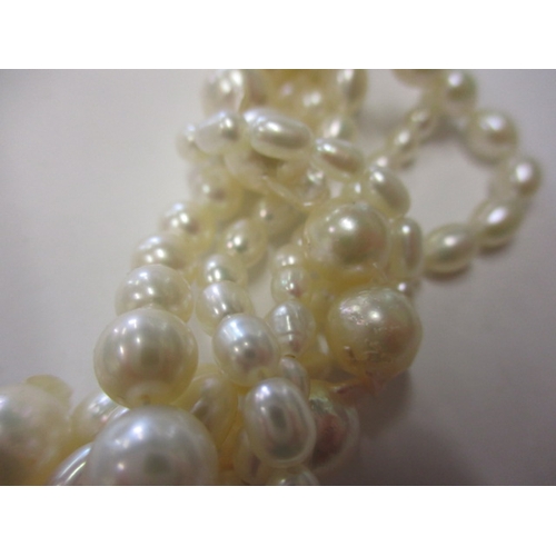 223 - A six strand baroque pearl necklace with 9ct gold clasp, approx. linear length 38cm, in good useable... 