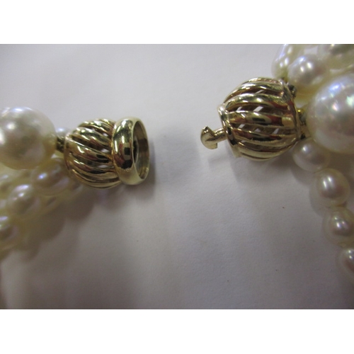 223 - A six strand baroque pearl necklace with 9ct gold clasp, approx. linear length 38cm, in good useable... 