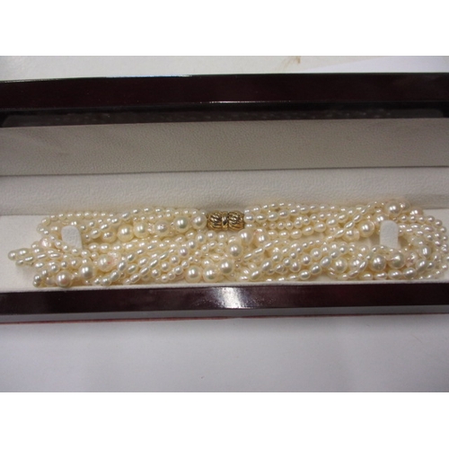 223 - A six strand baroque pearl necklace with 9ct gold clasp, approx. linear length 38cm, in good useable... 