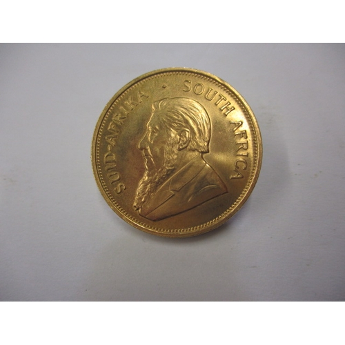 161 - A 1975 gold Krugerrand in near uncirculated condition, approx. weight 34g