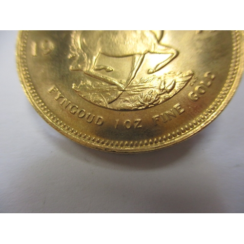 161 - A 1975 gold Krugerrand in near uncirculated condition, approx. weight 34g