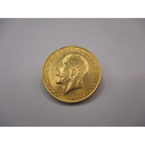 154 - A George V gold sovereign dated 1911, a circulated coin with very fine definition of features