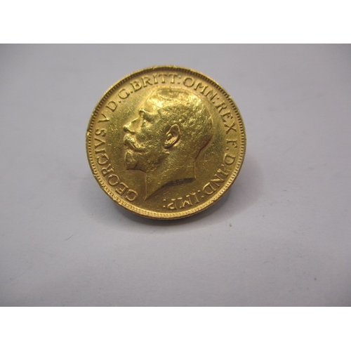 157 - A George V gold sovereign dated 1911, a circulated coin with fine definition of features