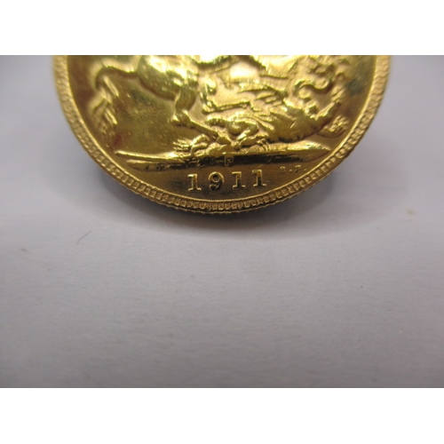 157 - A George V gold sovereign dated 1911, a circulated coin with fine definition of features