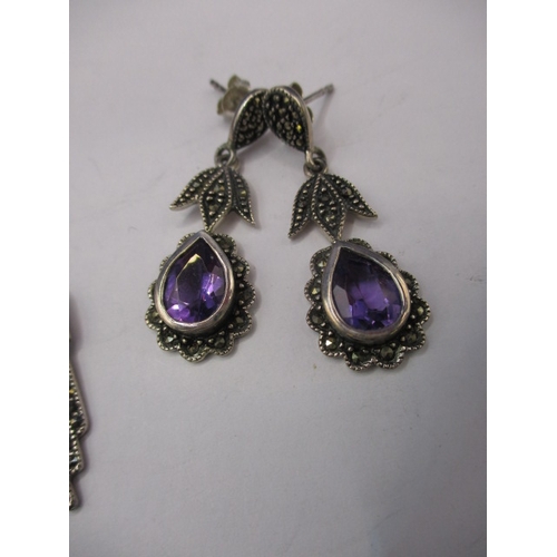 222 - A pair of art deco style earrings silver, marcasite amethyst on silver and another similar pair, in ... 