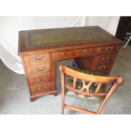 A 20th century 8 drawer pedestal desk, with green inset writing surface, comes in 3 parts for ease of transport, with associated desk chair, in pre-owned condition with use related marks, approx. size H: 76cm W: 122cm D:61cm