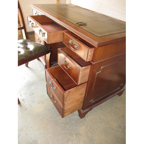 323 - A 20th century 8 drawer pedestal desk, with green inset writing surface, comes in 3 parts for ease o... 